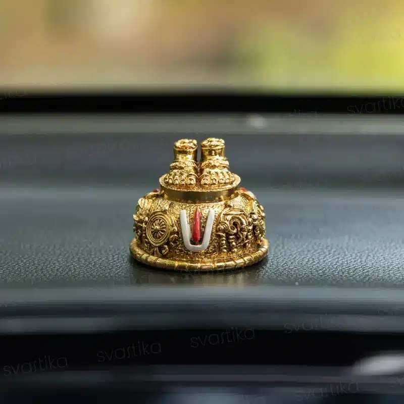 Balaji Charan gold plated idol on car dashboard