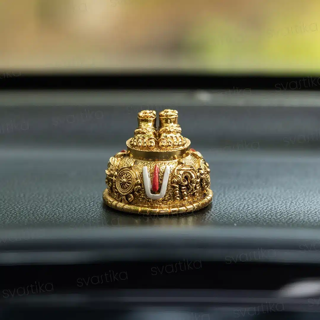 Balaji Charan gold plated idol on car dashboard